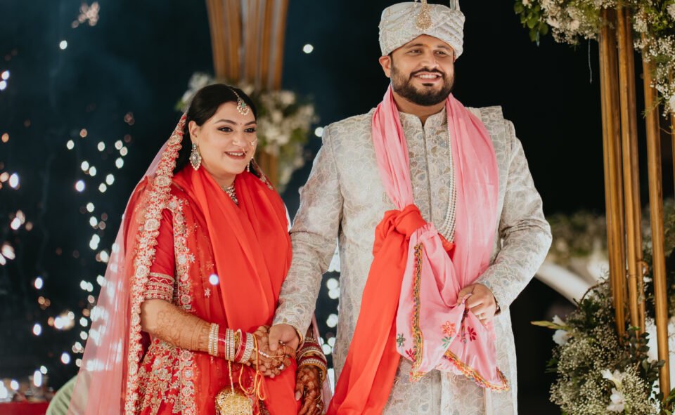 Bride and groom wedding portrait with floral decor at Novotel Hyderabad