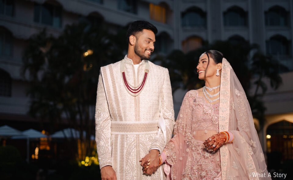 Bride and groom walking together at Taj Krishna Banjara Hills wedding venue