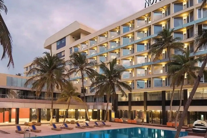 Novotel Juhu Beach Mumbai beachfront wedding venue with palm-lined pool