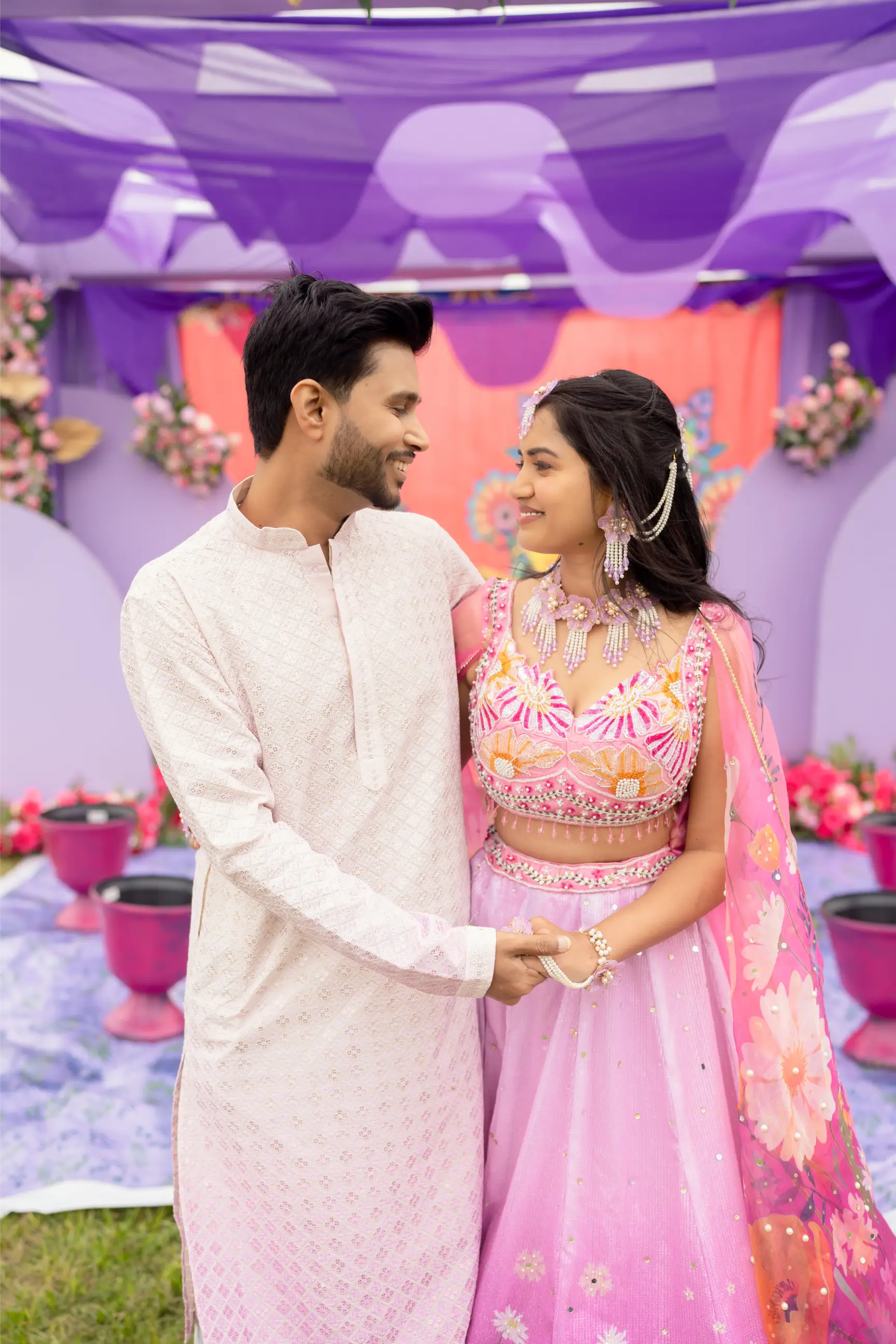 Couple seeing their faces each other with a smile.