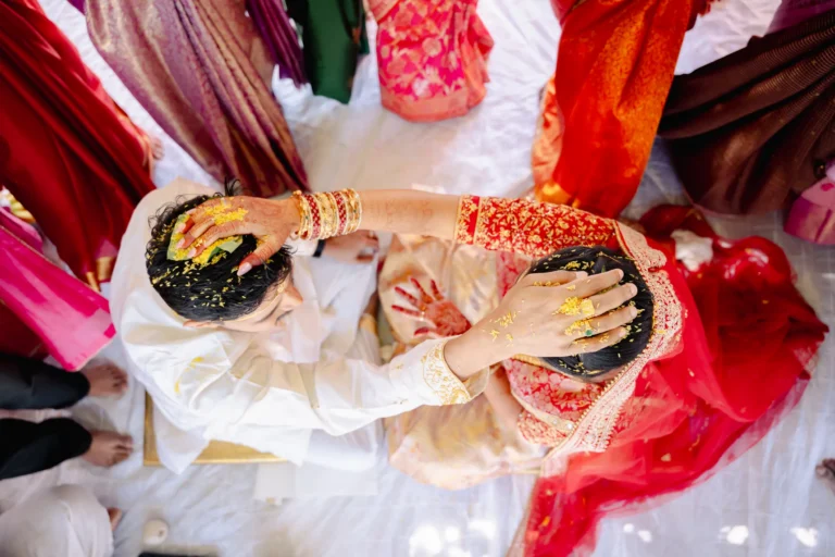 Bride & Groom was kept their hands on the other head for completing jeelakarra bellam ritual.