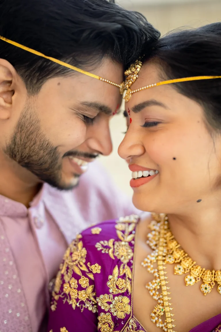 Couple close up touching their foreheads each other.