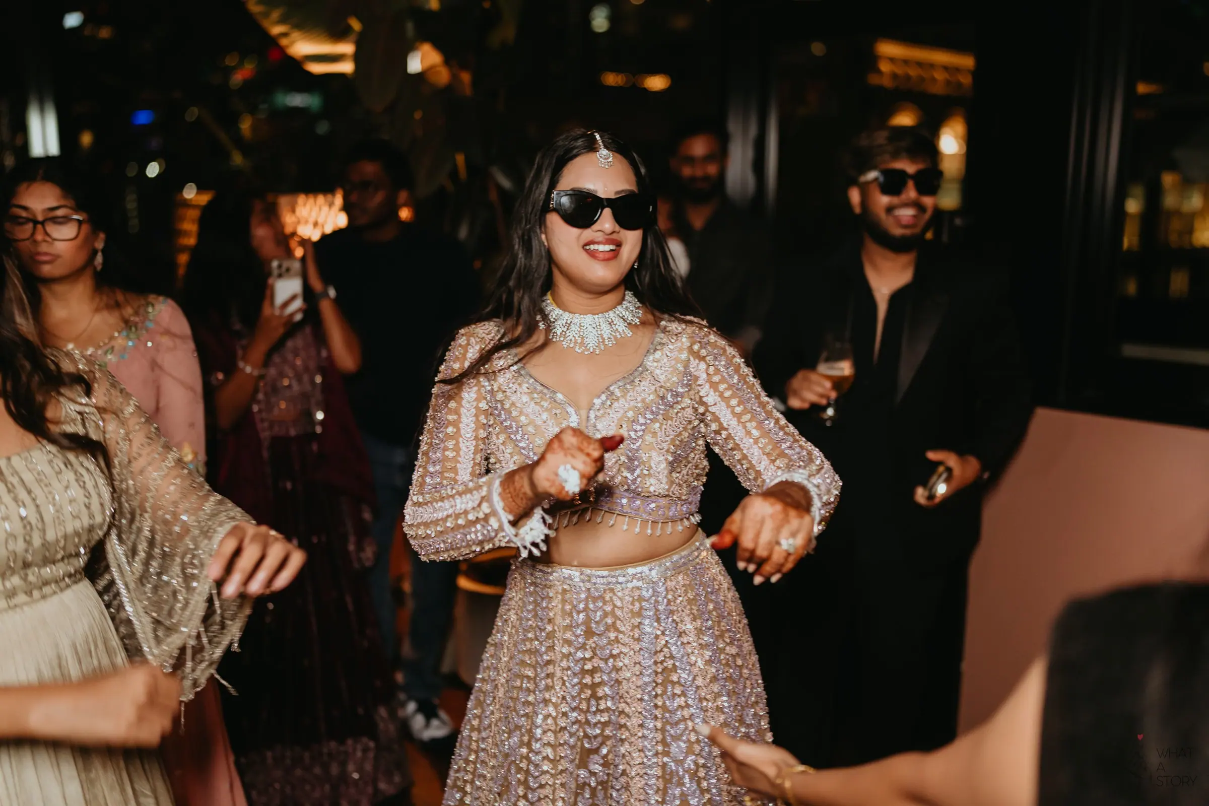 Bride dancing in sunglasses
